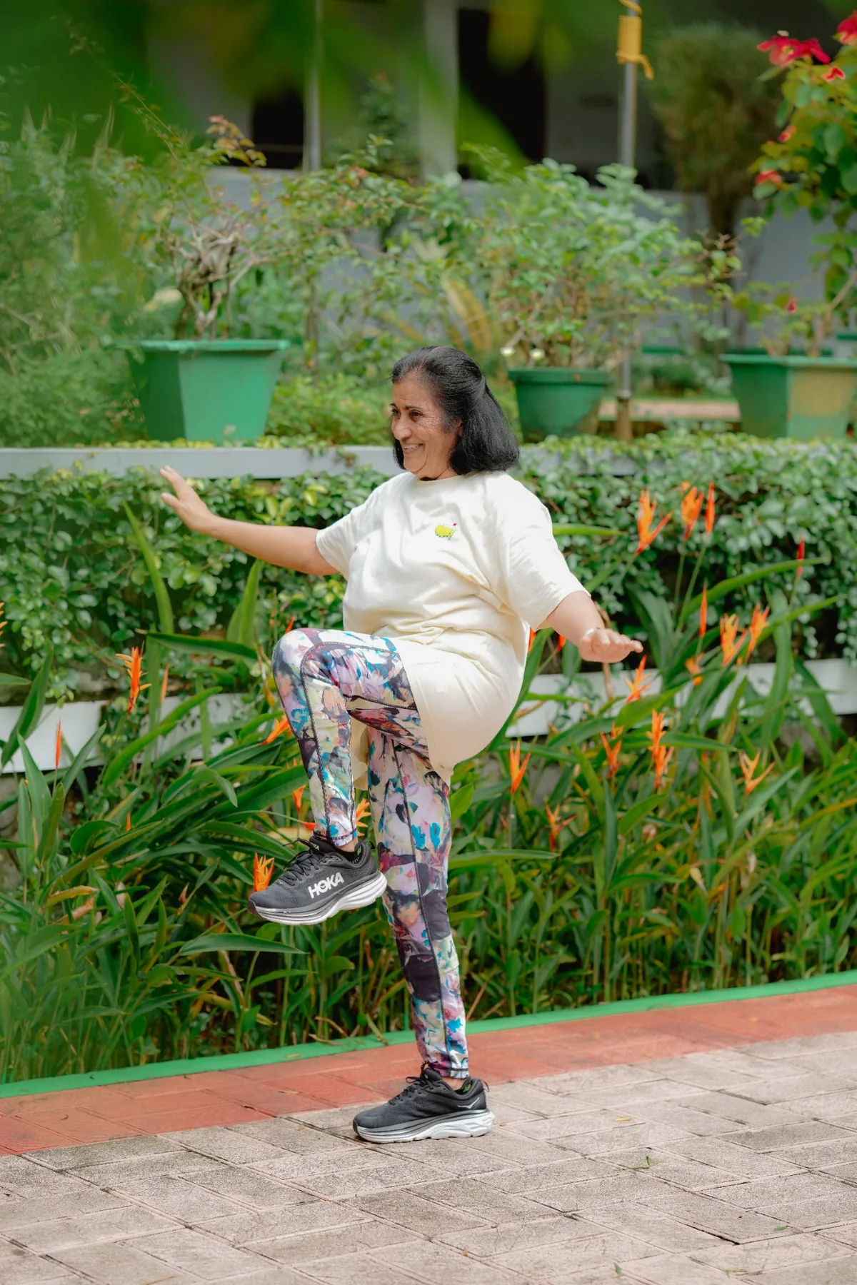 Senior resident exercising in the garden